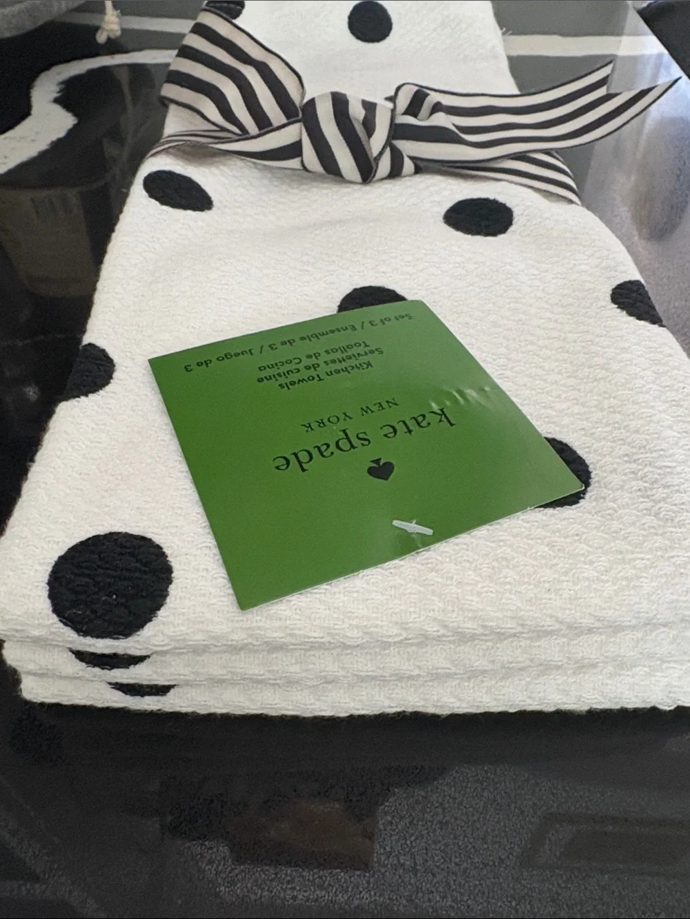 KATE SPADE Three black & white polka dot kitchen towels.